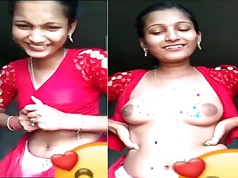 Disconsolate village girl teases with half-shirt and affiliated to of her tits